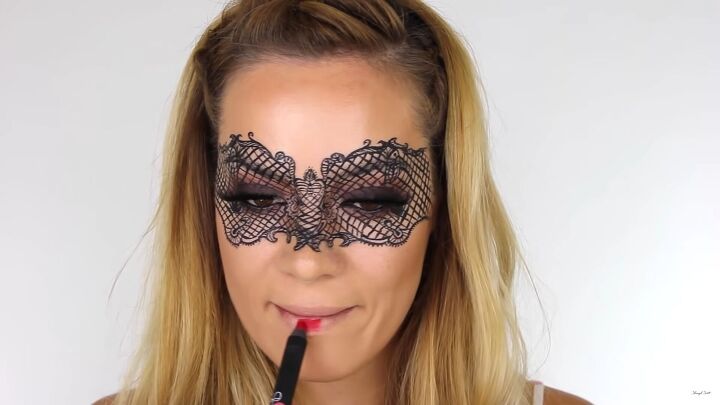 how to do intricate masquerade mask makeup with liquid eyeliner, Applying red lipstick