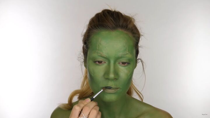 how to do perfect guardians of the galaxy gamora face makeup, Applying dark green lipstick