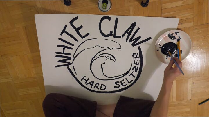 ain t no laws when you re making this fun white claw costume diy, Painting the logo for the White Claw costume