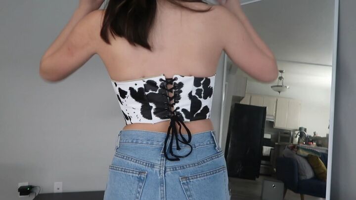 how to make a cute diy cow costume bustier for halloween, Threading a ribbon through the eyelets