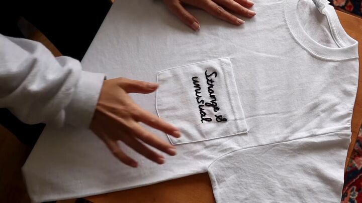 3 easy no sew diy clothing projects for refashioning old clothes, Embroidered quote on a t shirt pocket