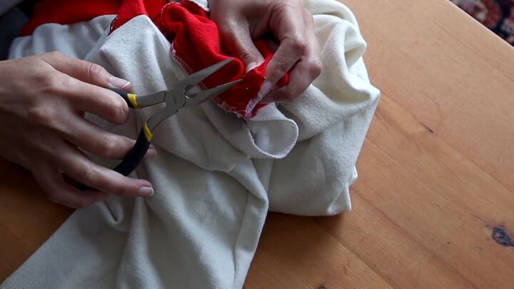 3 easy no sew diy clothing projects for refashioning old clothes, Using pliers to remove the metal studs