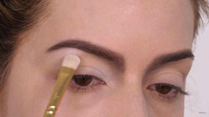 how to do fun diy cruella de vil makeup for halloween, Applying white eyeshadow on the brow bone