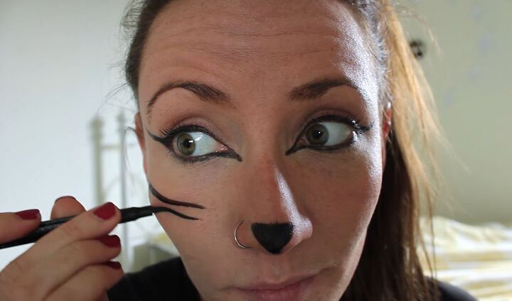2 super easy halloween costumes you can make in 10 minutes, Painting whiskers for a Halloween cat costume