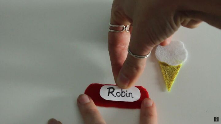 how to make a cute diy robin of stranger things costume for halloween, Making Robin s Scoops Ahoy name tag