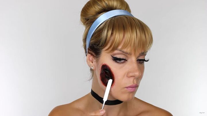 how to do scary halloween cinderella makeup with a glass slipper wound, Applying wound filler to the face