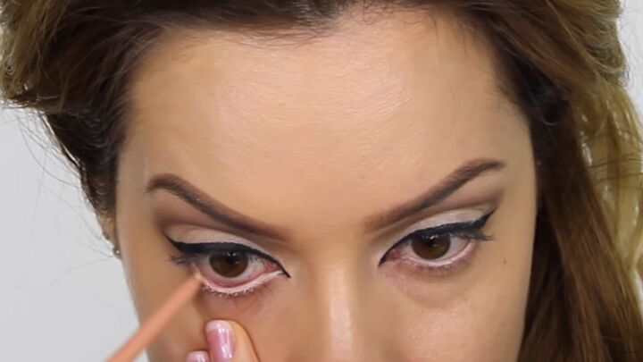 try this fun scary belle from beauty and the beast halloween makeup, Lining the waterline with a light eye pencil