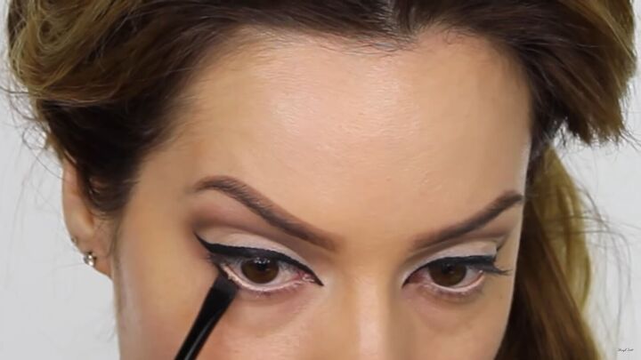 try this fun scary belle from beauty and the beast halloween makeup, Applying eyeshadow under the lower lashes