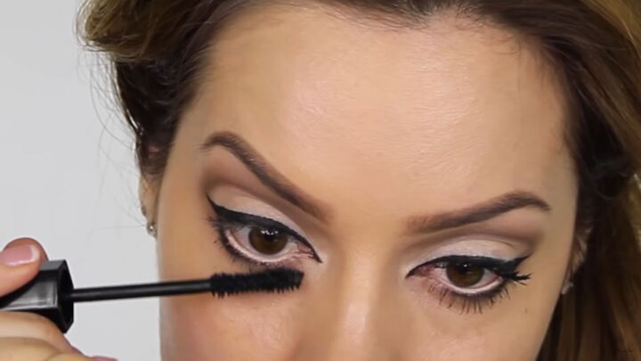 try this fun scary belle from beauty and the beast halloween makeup, Applying mascara to the bottom lashes