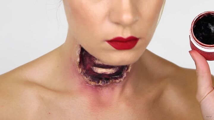 this gory ariel little mermaid makeup look is perfect for halloween, Applying wound filler