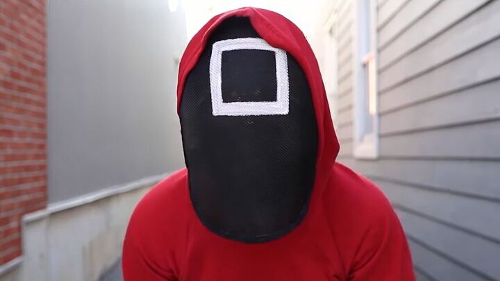 how to make an easy diy squid game guard costume red suit mask, DIY red suit and square mask from Squid Game