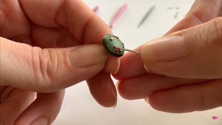 use this polymer clay applique tutorial to make pretty floral earrings, Pressing the petals onto the earring base