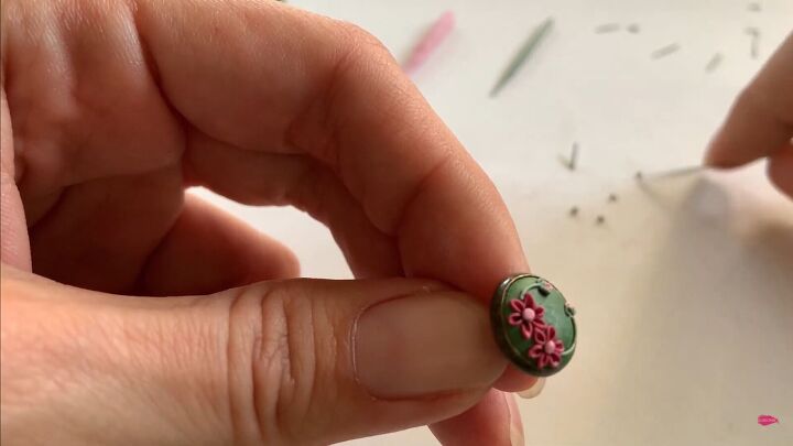 use this polymer clay applique tutorial to make pretty floral earrings, Pressing the pieces into the design