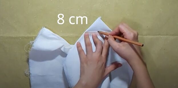 how to sew a reversible tote bag with pockets step by step tutorial, Drawing lines across the bag corners
