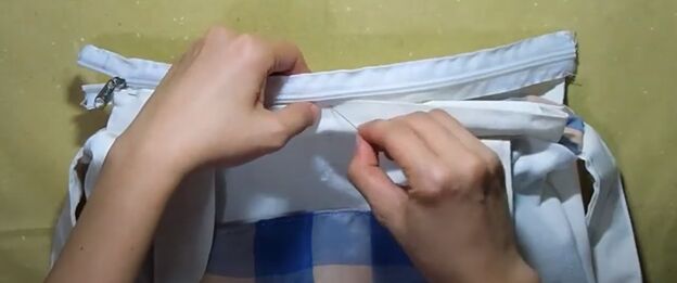 how to sew a reversible tote bag with pockets step by step tutorial, Sewing the zipper onto the casing