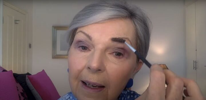 the 9 best makeup products for over 50 women, Using a spoolie brush to blend brow filler