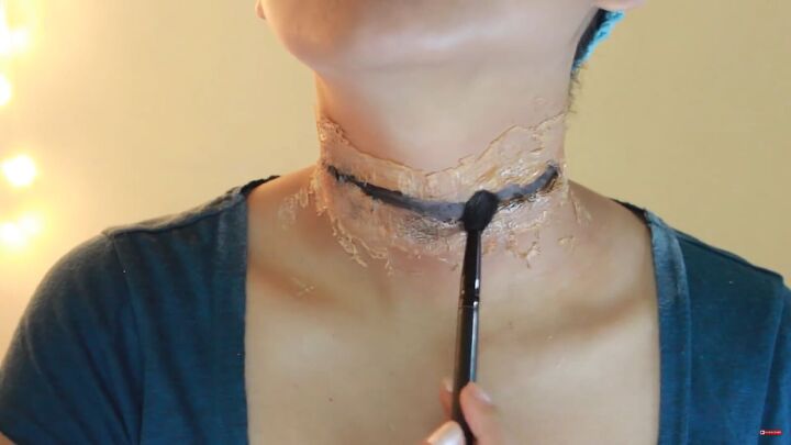 how to do scary slit throat makeup for halloween using kitchen items, Applying dark brown eyeshadow