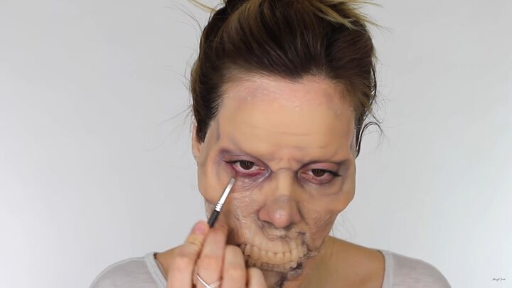 looking for a fun halloween look try this chilling zombie sfx makeup, Applying red around the lash lines