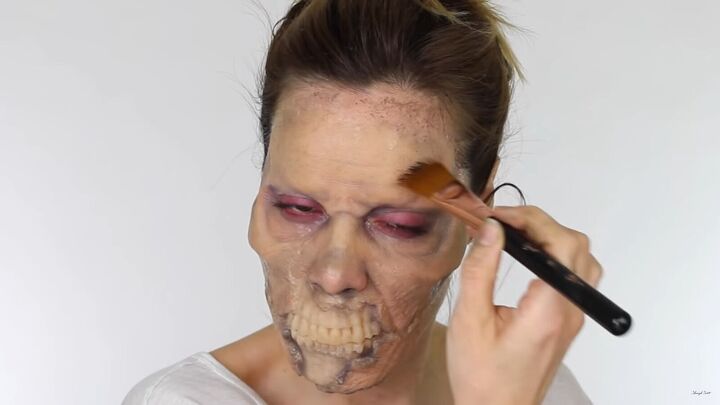 looking for a fun halloween look try this chilling zombie sfx makeup, Applying black paint to the skin