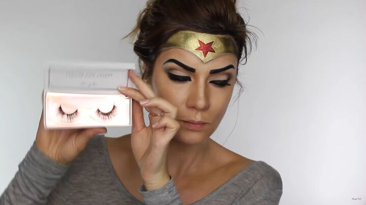 how to do effective comic book wonder woman makeup for halloween, Applying fake lashes
