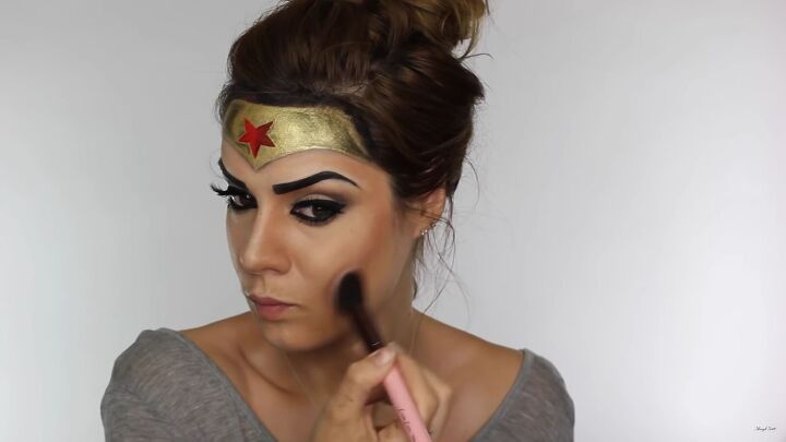 how to do effective comic book wonder woman makeup for halloween, Applying a peach blush color