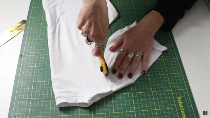 how to make a fun diy starlight costume from the boys this halloween, Folding the t shirt to keep it symmetrical