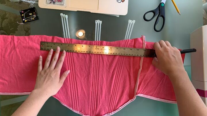 how to make a pretty diy corset tank top with old tees zip ties, Measuring the top hem of the corset