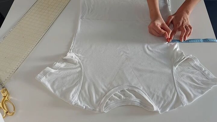 how to make a drawstring crop top out of an old t shirt, Marking the t shirt ready to cut