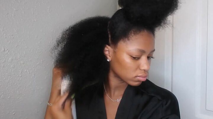 how to easily do a sleek top knot bun on natural hair, Spraying hair with water