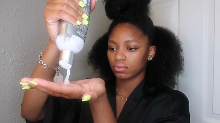 how to easily do a sleek top knot bun on natural hair, Applying leave in conditioner