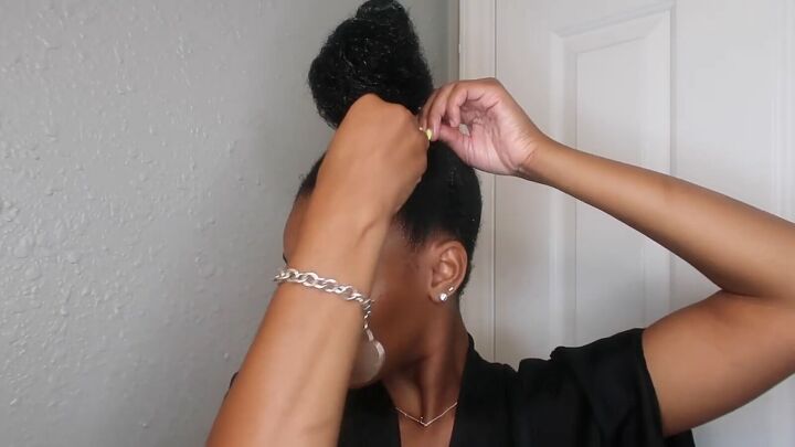 how to easily do a sleek top knot bun on natural hair, Securing the top knot with bobby pins