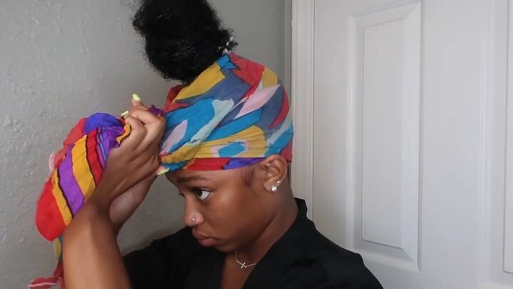 how to easily do a sleek top knot bun on natural hair, Tying a scarf around your head