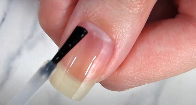 how to take care of long nails keeping natural nails long strong, Applying a clear base coat to nails