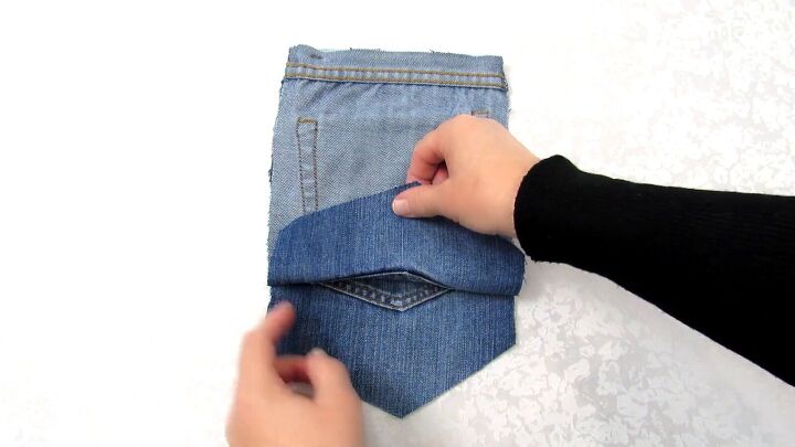 how to make a jean pocket purse with cute fringe detailing, Making a DIY purse from old jeans