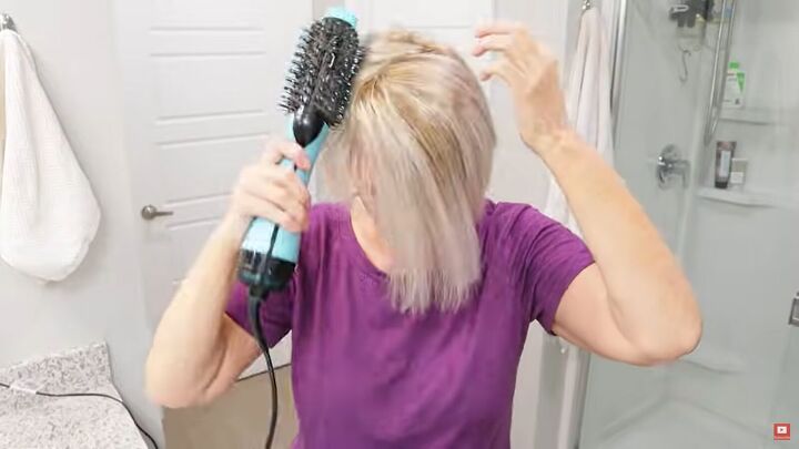 how to style short hair over 50 for youthful volume lift, Blow drying hair with a brush