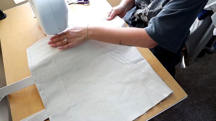 how to make a market tote bag with an adorable embroidered design, Sewing the side seams of the bag