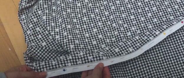 how to make a cute custom raincoat from an old coat gingham fabric, Pinning the zipper to the fabric