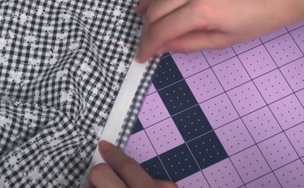 how to make a cute custom raincoat from an old coat gingham fabric, Aligning the hems