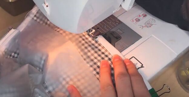 how to make a cute custom raincoat from an old coat gingham fabric, Topstitching the bias tape