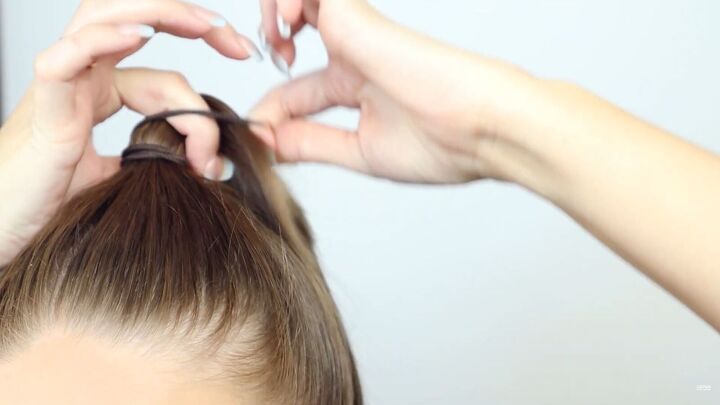 7 easy hairstyles for dirty hair how to make third day hair look cute, Tying hair in a high ponytail