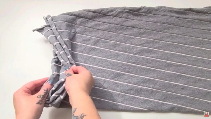how to easily make cozy diy lounge pants out of an old bedsheet, Laying the fabric down to create 4 layers