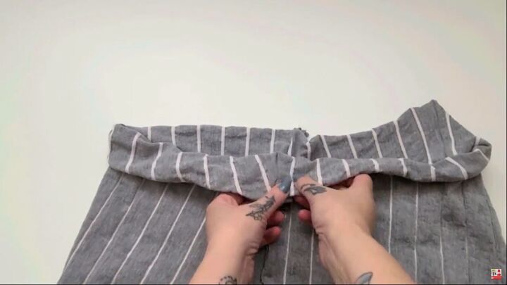 how to easily make cozy diy lounge pants out of an old bedsheet, Folding the fabric over the elastic