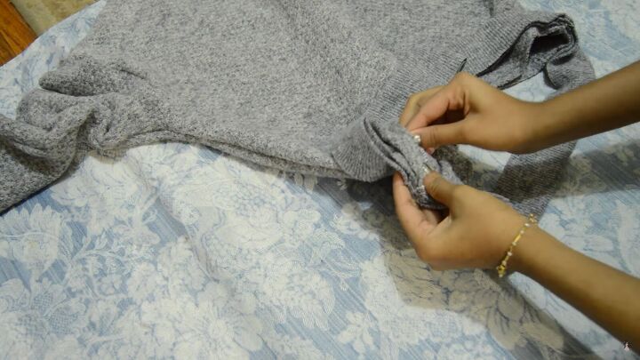 how to make a cute cozy knit sweater from scratch in 5 simple steps, Pinning ribbed fabric to the waist