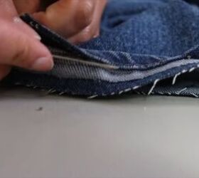 jeans too long here s how to hem flared jeans keep the original hem, Pushing in the fabric that s left