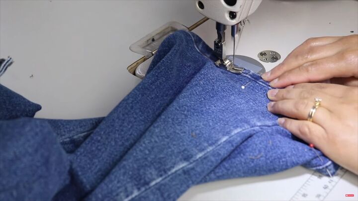 jeans too long here s how to hem flared jeans keep the original hem, Finishing the hem of the flared jeans