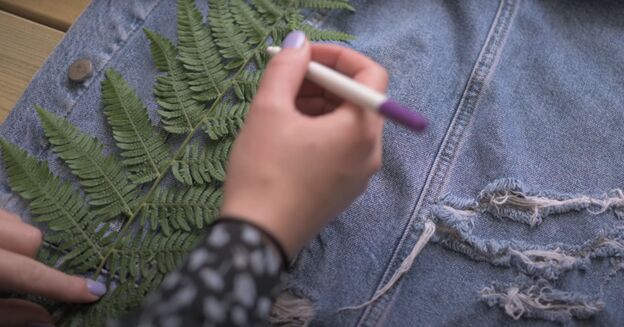 how to paint a denim jacket a super cute way to upcycle your wardrobe, Marking where to paint the design