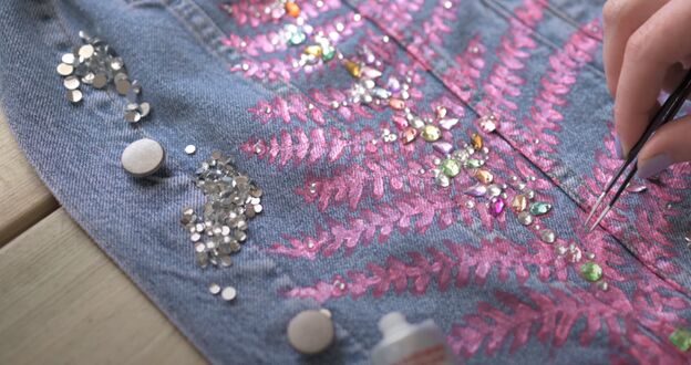 how to paint a denim jacket a super cute way to upcycle your wardrobe, Embellishing the denim jacket with crystals