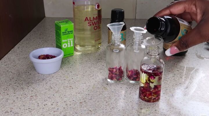 how to make diy rose oil for your face in just 3 simple steps, Adding the oils to the bottles