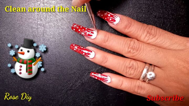 create these magical aesthetic christmas nails in 5 simple steps, Cleaning around the nail with acetone