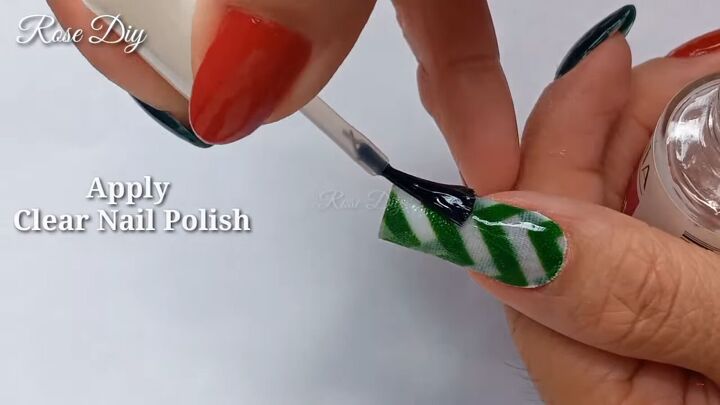 washi tape nails decorate nails with washi tape for a festive look, Applying a top coat over the washi tape nails
